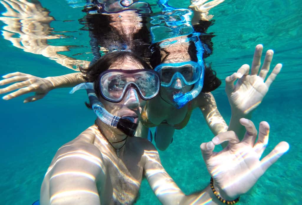 Young couple snorkeling in the honeymoon